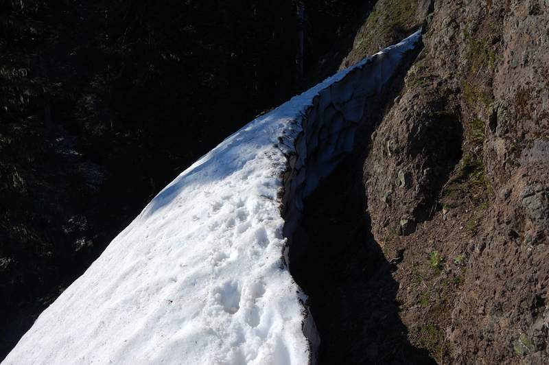 On the left (west) side of the rock was this snow barrier - this thing is at least 5 feet high on the wall side! We walked on top of it to the rock, but it's too steep to climb there