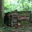 stevens shelter; note old stove pipe.  inside there was a stove, bedroll, lantern, some old cans