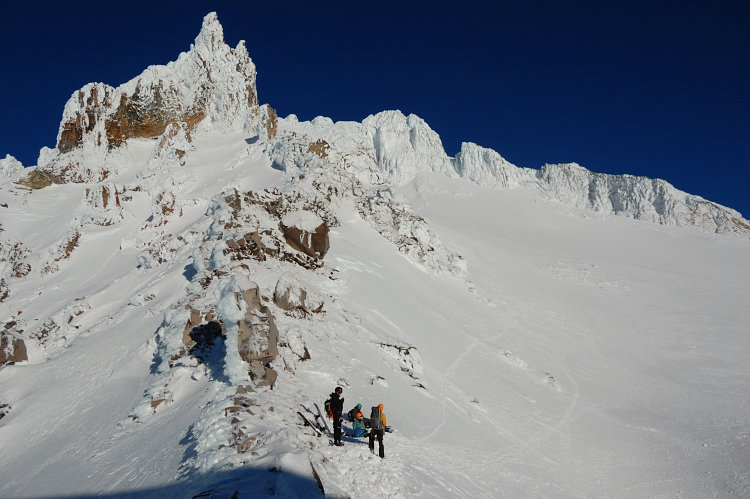 Snowboarders after their near-summit ascent