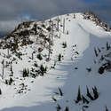 Back side of "Stump Hill", as seen from Arch RIdge. Note a huge snowdrift at the saddle