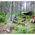 some of the guys sitting around the fire